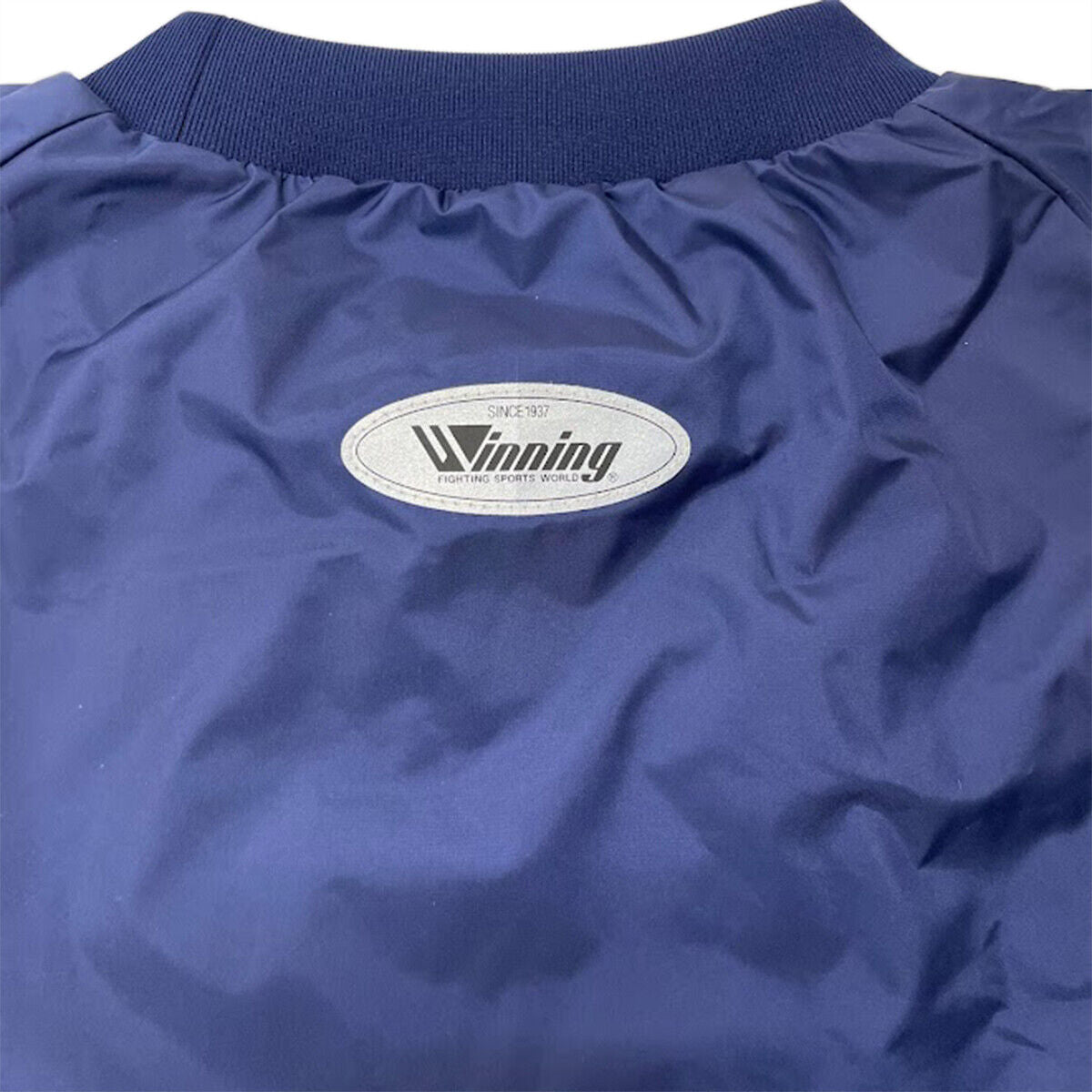 Winning F-77 navy sauna suit - reflective detail
